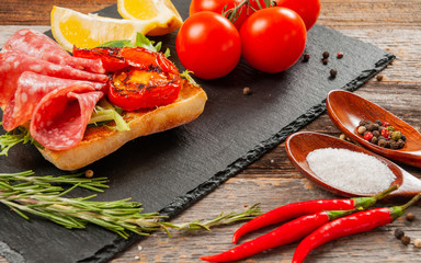 Healthy Breakfast. Fresh sandwich with salami and tomato.
