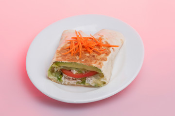 Carrot and tomato mixed bun on plate,