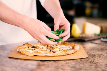 man making pizza