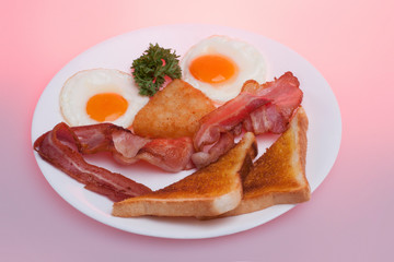 Breads with meats and eggs on plate