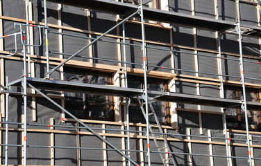 scaffold at house prepared for thermal insulation