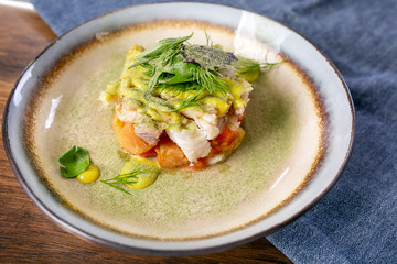 Pickled cod. European cuisine. The work of a professional chef. Dish from a restaurant or cafe menu. Close-up