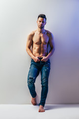 Naklejka premium Full length portrait of sexy muscular shirtless man