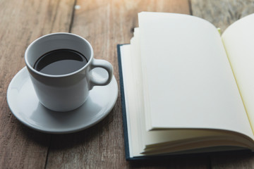 Obraz na płótnie Canvas Notebook with coffee cup