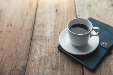 Notebook with coffee cup