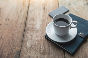 Notebook with coffee cup