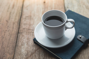 Notebook with coffee cup