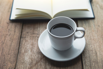 Notebook with coffee cup
