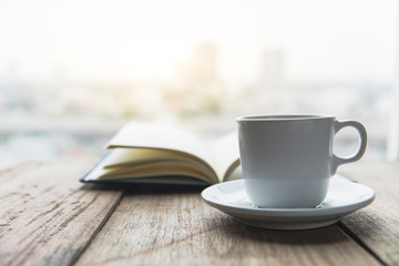Notebook with coffee cup