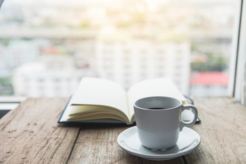 Notebook with coffee cup