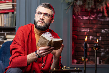 Fortune-teller having real inspiration after reading old book