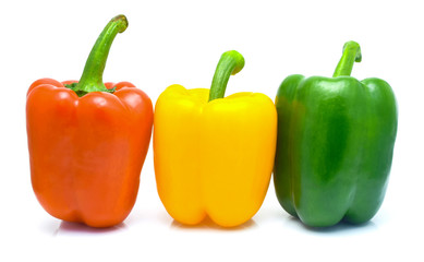 Red, yellow, green fresh and healthy peppers on white background