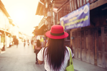 Woman traveler in Chiang Khan walking street in Loei Thailand.