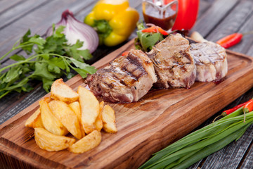  juicy and appetizing steak tamogavok of horse meat on the table, for design in cooking