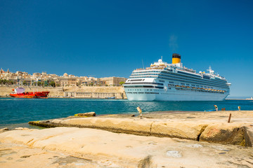 Fototapeta na wymiar Cruise ship and Valletta harbor view from Birgu. Malta
