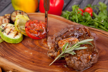  juicy and appetizing steak tamogavok of horse meat on the table, for design in cooking