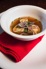 White plate with onion mixed cheese soup