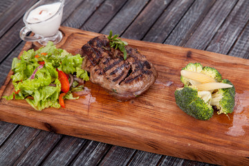  juicy and appetizing steak tamogavok of horse meat on the table, for design in cooking