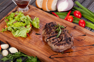  juicy and appetizing steak tamogavok of horse meat on the table, for design in cooking