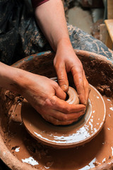 Potter at work. Workshop place.