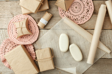 Holiday natural decoration or gift idea - natural soap in paper package, zero waste lifestyle concept, monochrome background, copy space