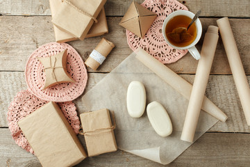 Holiday natural decoration or gift idea - natural soap in paper package, zero waste lifestyle concept, monochrome background, copy space, preparation for holiday