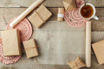 zero waste eco friendly wrapped of gift boxes on wintage wooden background, ecologial lifestyle and holiday background, copy space, flat lay