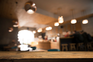blurred background of bar and dark brown desk space of retro wood