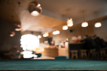 blurred background of bar and dark brown desk space of retro wood