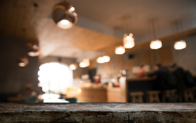 blurred background of bar and dark brown desk space of retro wood