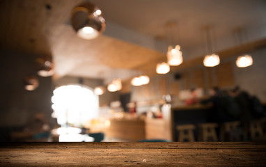 blurred background of bar and dark brown desk space of retro wood