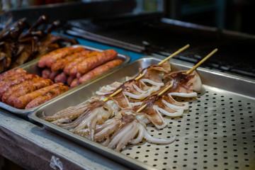 Fresh squid for BBQ at night market street food stall
