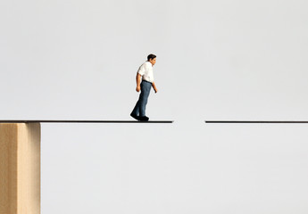 A man of middle age who is walking down a broken way.