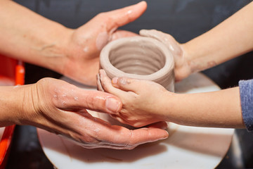 Modeling of clay on a potter's wheel In the pottery workshop