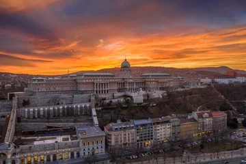 Deurstickers Budapest, Hungary - Aerial view of Buda Castle Royal Palace with a dramatic golden sunset at winter time © zgphotography