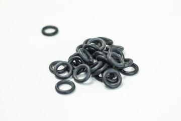 O-ring tool equipment, black O-Rings on white background.