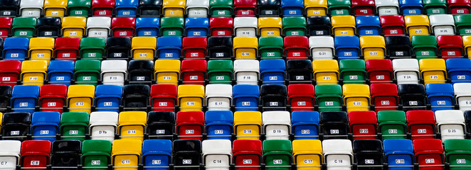 Fototapeta premium view on rows of plastic seats in a grandstand, pattern of folding chair in a stadium, sitting area for spectator