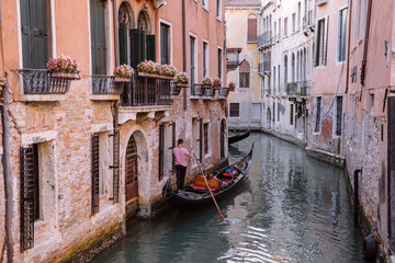 Panoramic view of Venice canal with historical buildings and gondolas
