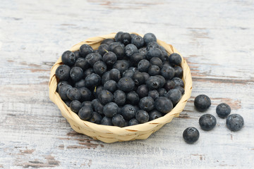 blueberries in the basket on wood