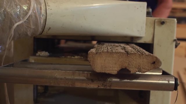 Joiner whittle workpiece of wood with jack-plane slow motion. Joiner whittle workpiece of wood with jack-plane