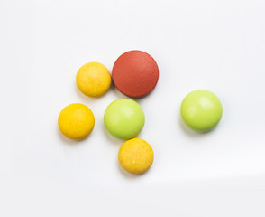 set of multi-colored tablets  on a white background