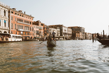 Panoramic view of Grand Canal (Canal Grande) with active traffic gondolas