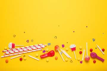 Minimal happy birthday decor for party. Sweet candy, balloons, straw. Copy space for text.