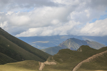 Panorama of road in mountains ofnational park Dombay, Caucasus