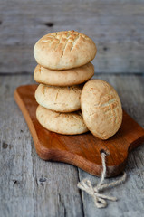 Stacked homemade cookies on wooden plate