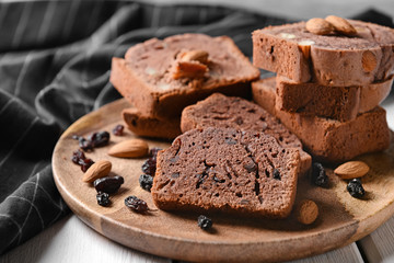 Pieces of tasty chocolate cake on plate, closeup