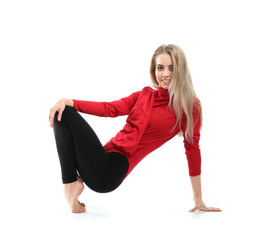 Young female dancer on white background
