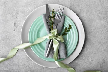 Beautiful Easter table setting on grey background