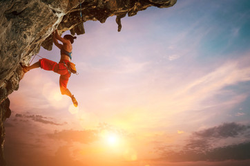 Woman climbing on rock