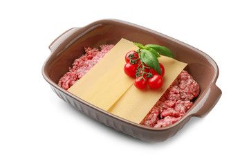 Casserole with minced meat and lasagna sheets on white background